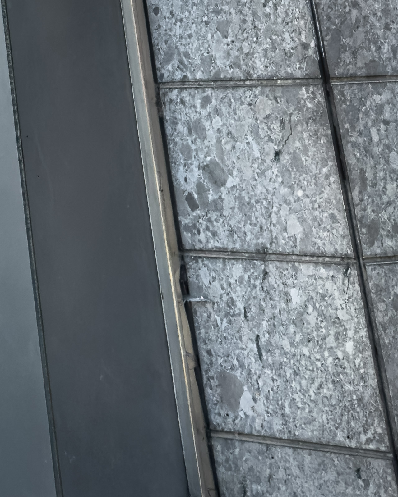 Stone and concrete wall detail at the base of the former cinema in Zeltweg.