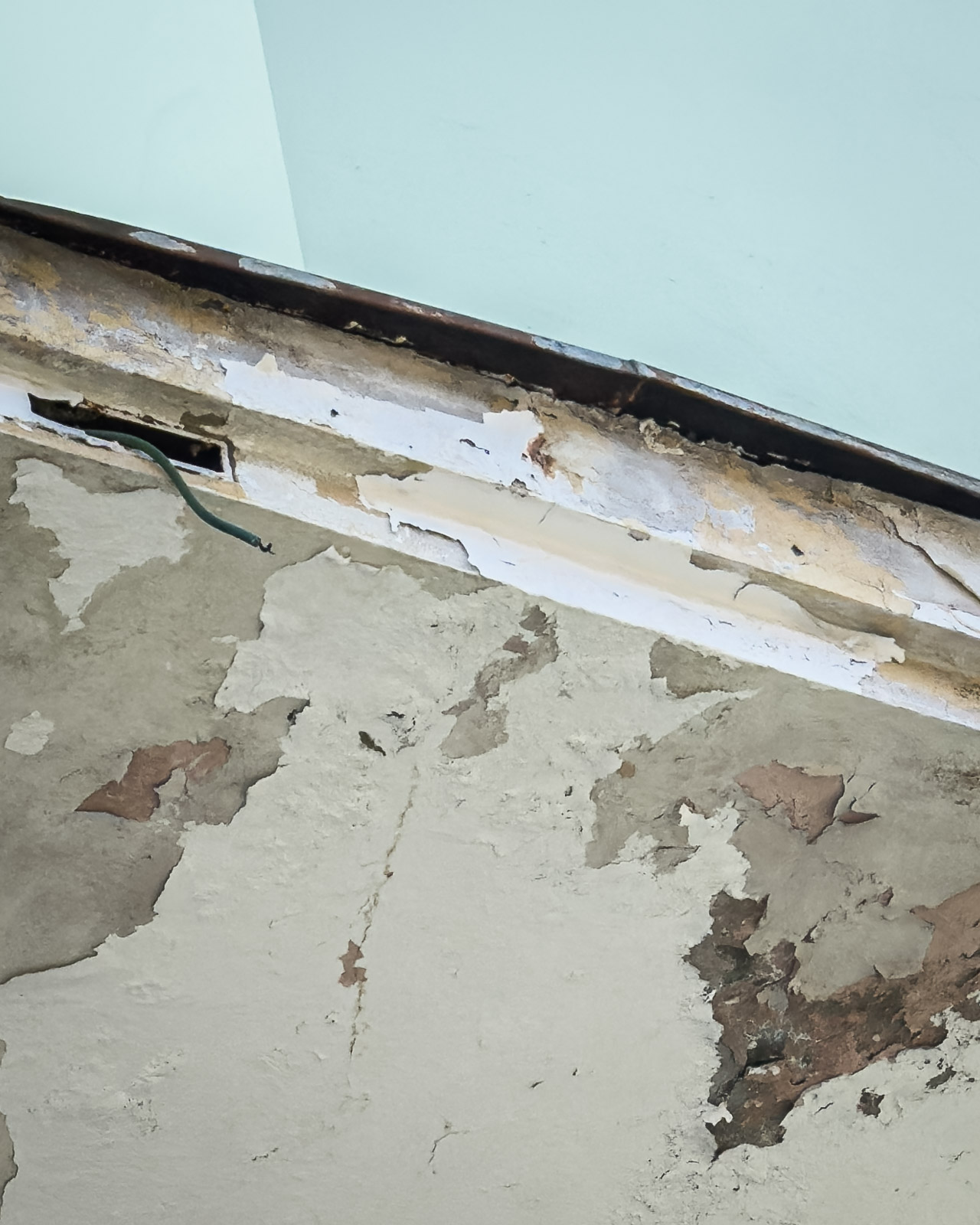 Peeling facade detail of the former cinema building in Zeltweg.