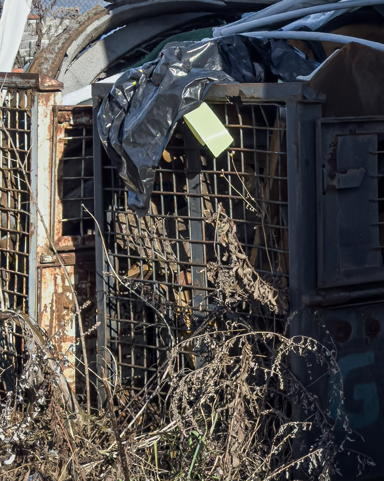 Damaged interior of an abandoned vending machine with exposed metal structure in Zeltweg